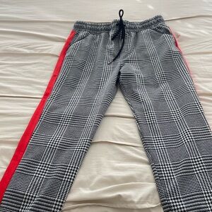 Super cute pants with red stripes on sides